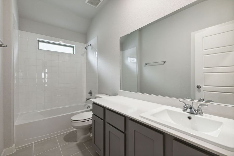 Bathroom in the Oscar home plan by Trophy Signature Homes – REPRESENTATIVE PHOTO