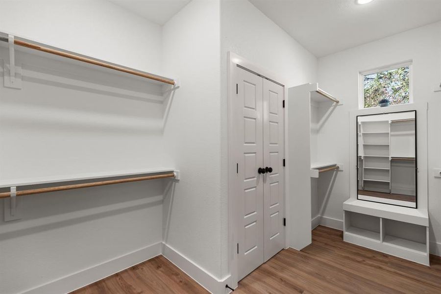 Spacious closet featuring hardwood / wood-style floors