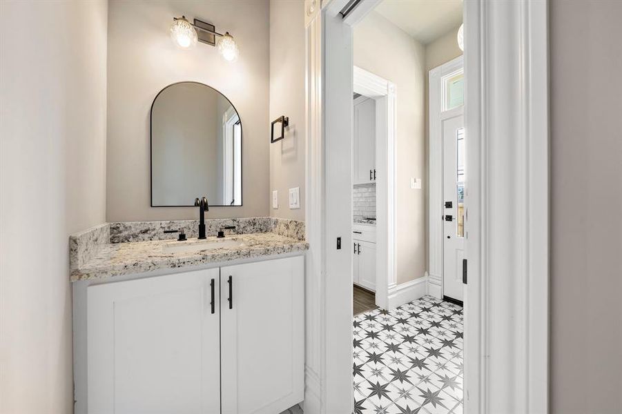 Half bath, just off the mudroom. Note the back door - access to / from the carport and backyard