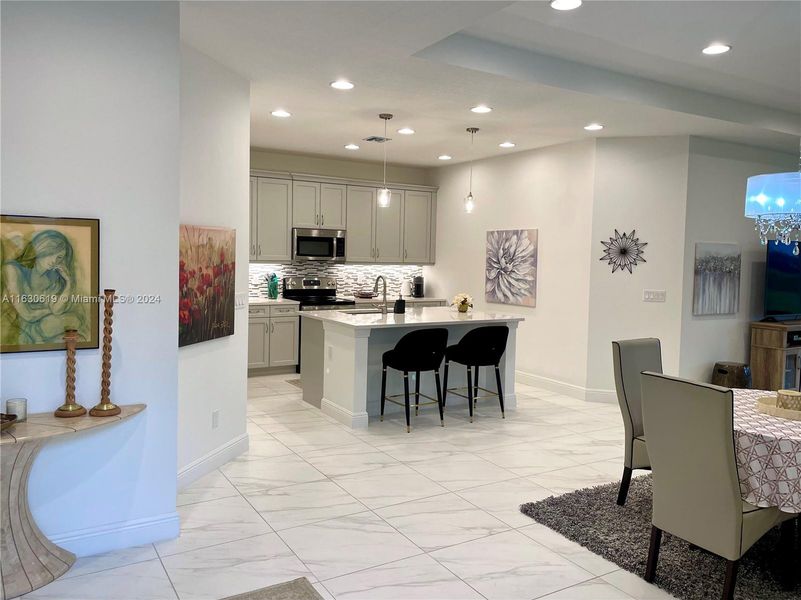 The kitchen and dining area as viewed from the main entry to the home