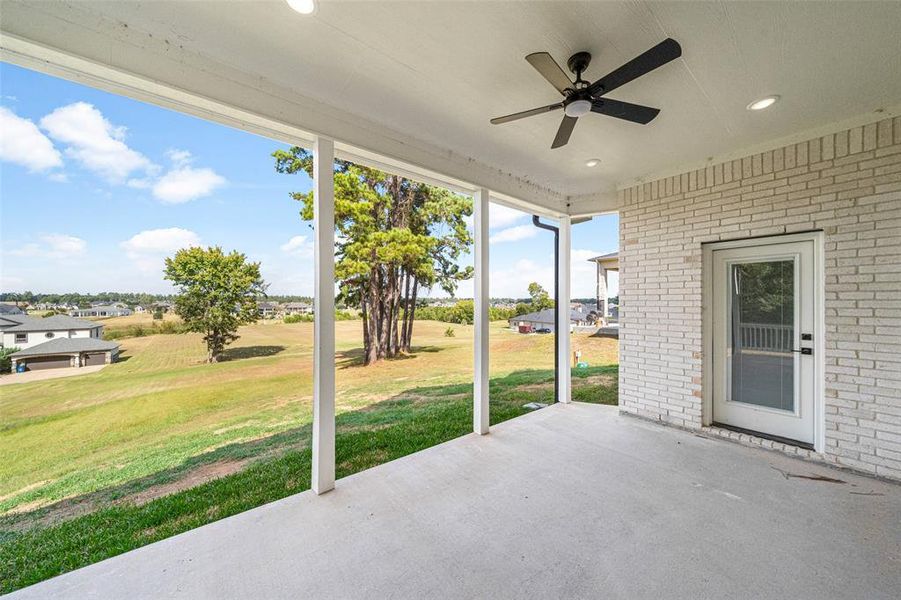 Covered back patio with entrance from primary & breakfast room