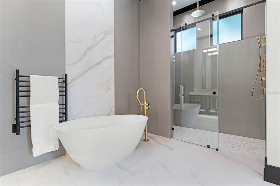 Owners suite bathroom tub and shower