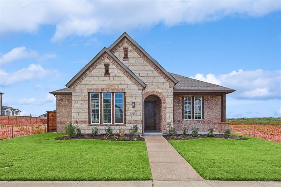 View of front of property with a front lawn