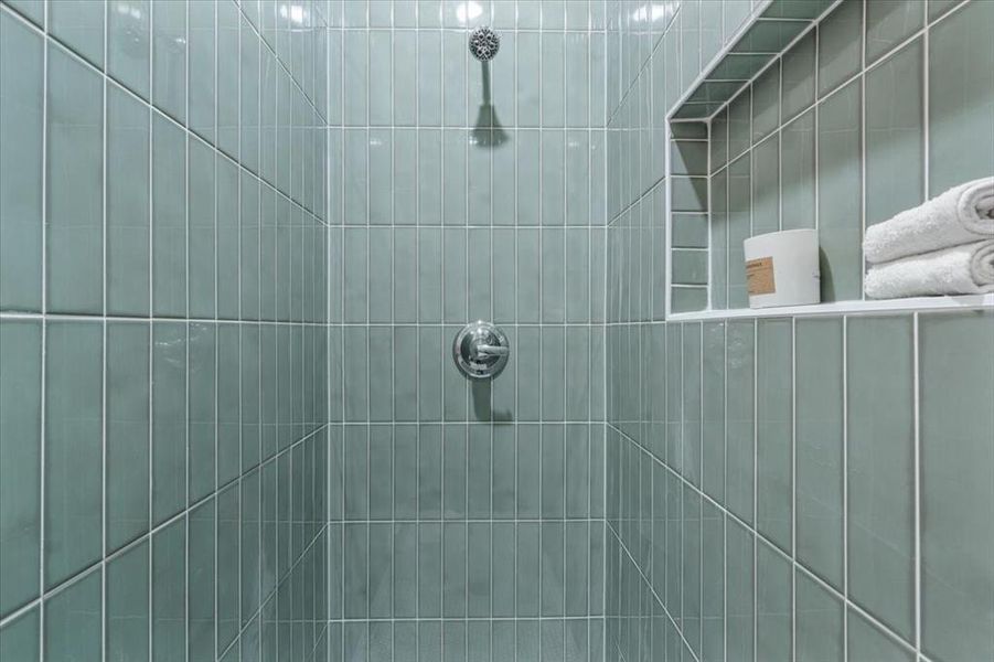 Bathroom featuring tiled shower