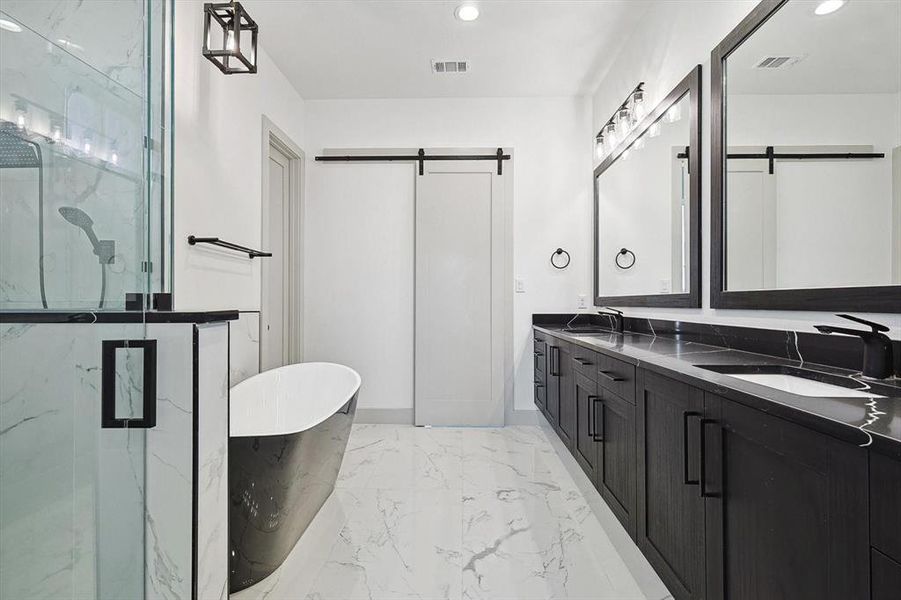 Bathroom with vanity and separate shower and tub