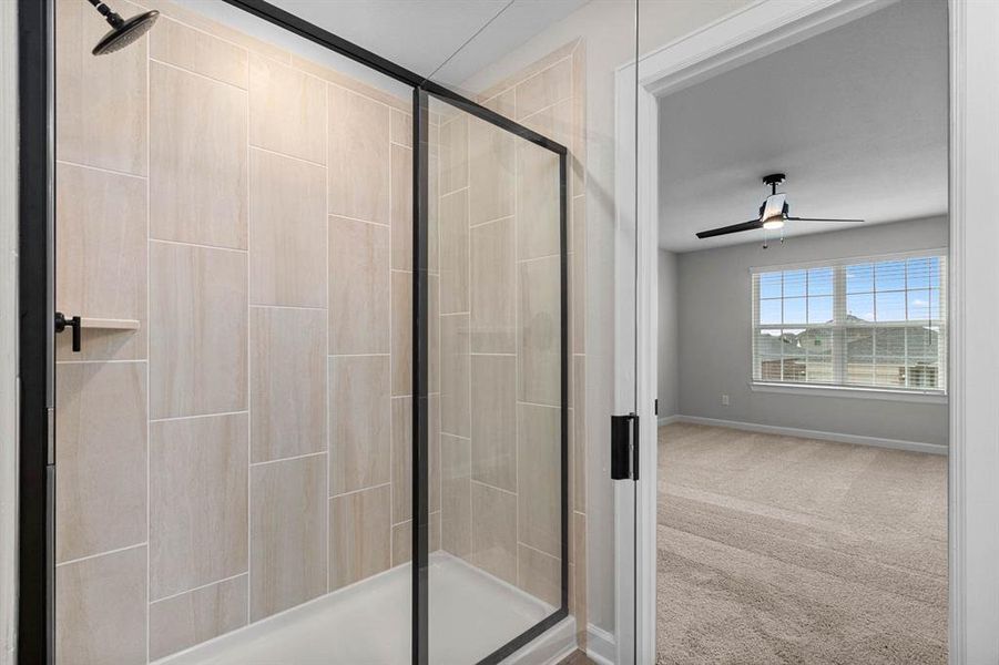 The large walk-in shower in the en-suite bathroom serves as a personal oasis, offering a tranquil escape from the stresses of daily life, with its spacious interior and invigorating showerhead creating a soothing environment for relaxation and rejuvenation.