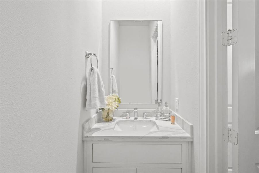 This well-appointed half bathroom is great for when you have family, friends, and guests over.