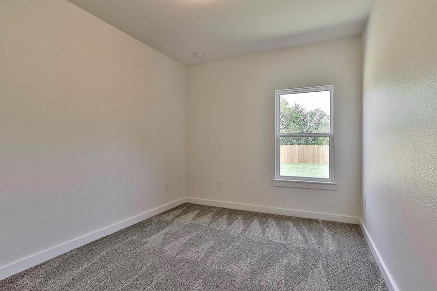 Spare room with carpet flooring