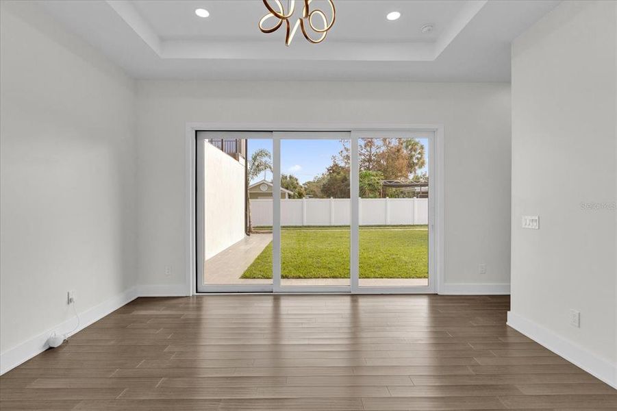 Light pours into primary bedroom from back yard