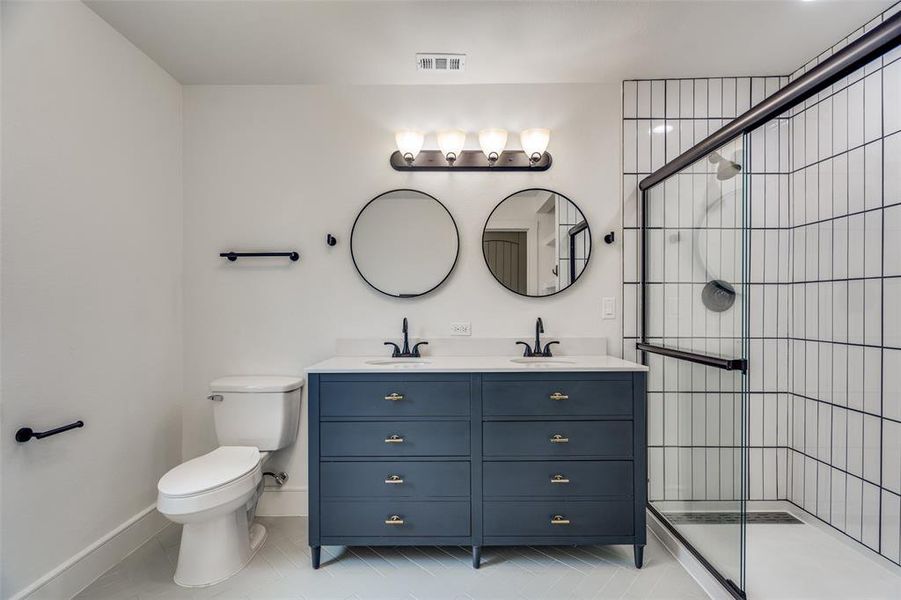 Primary bath with all new EVERYTHING from the walls, wiring, plumbing behind the walls to the fixtures in the bath.    New construction in the neighborhood STARTS at double this price!