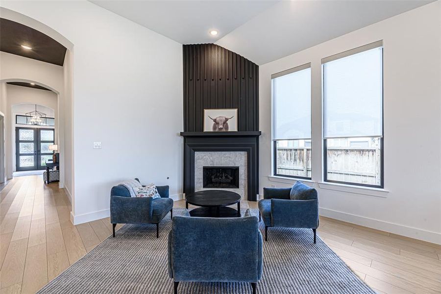 The den is the perfect entertainment setting with a modern fireplace as the main feature!