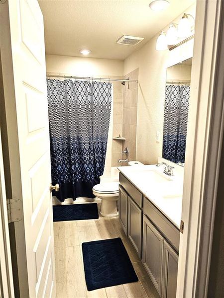 Hall bathroom with double sinks