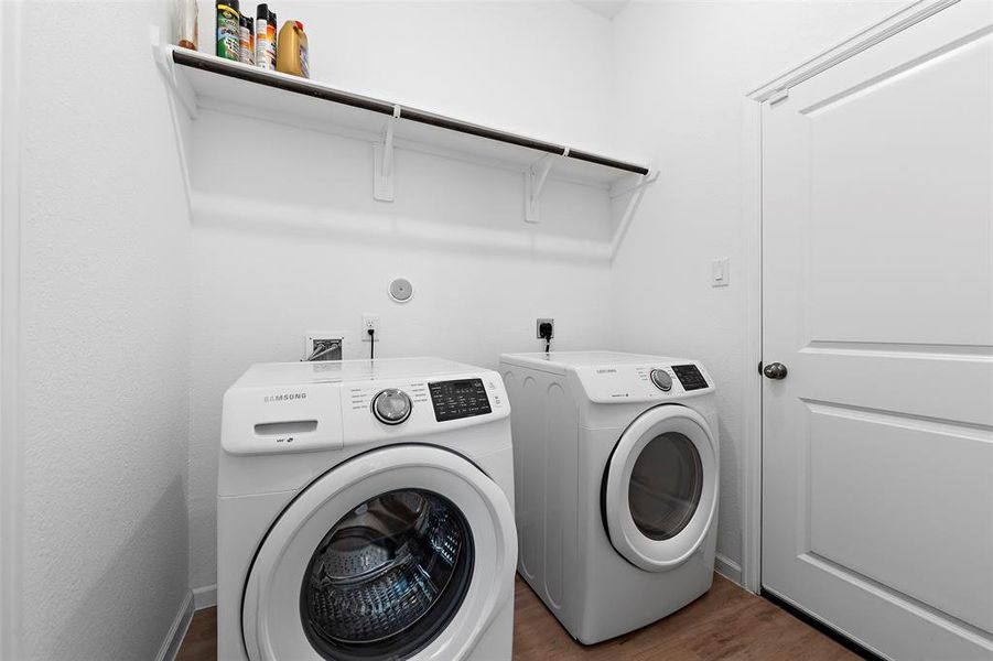 The laundry room is between the garage and the master closet.  Washer and dryer stay!