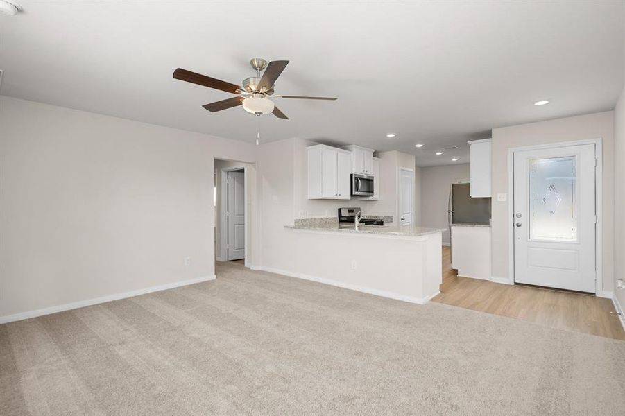 The living room is open towards the kitchen which makes entertaining a breeze.