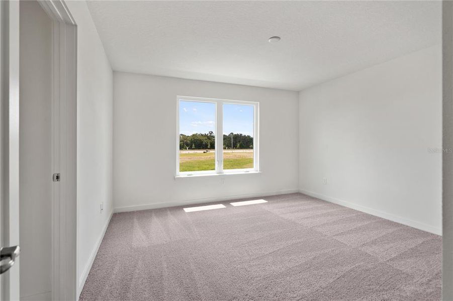 Bright primary bedroom.