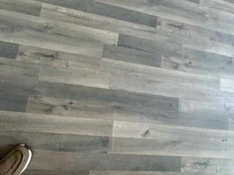 Flooring throughout entire home is wood plank laminate