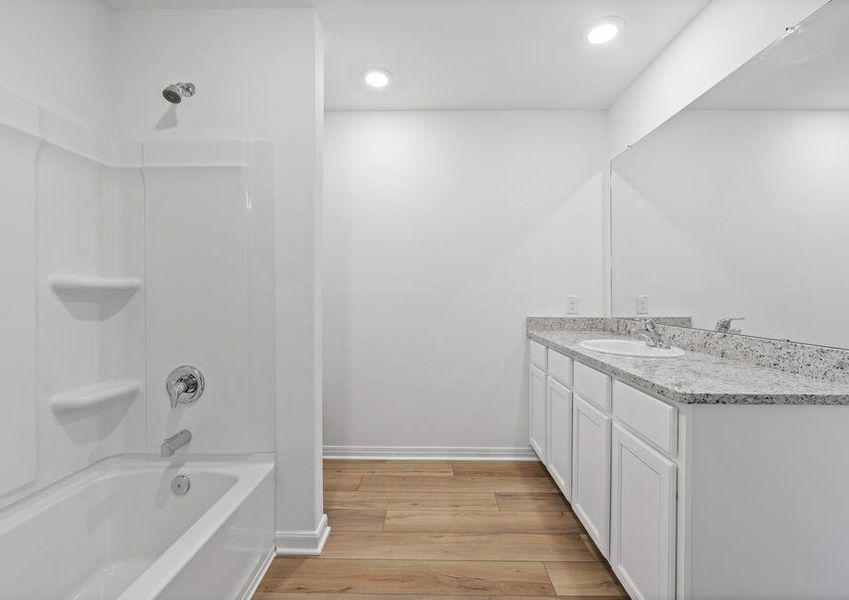 The master bathroom features granite countertops