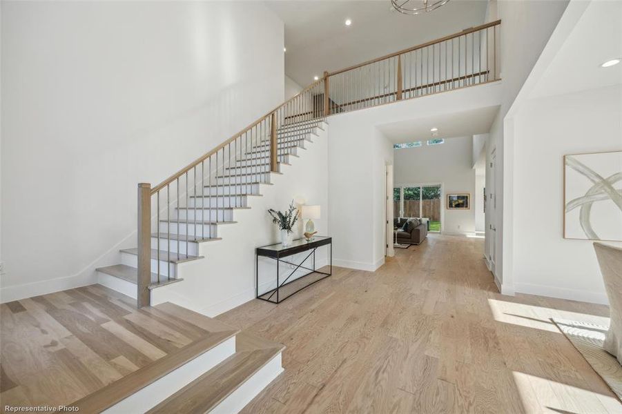 Foyer entry with grand stair case