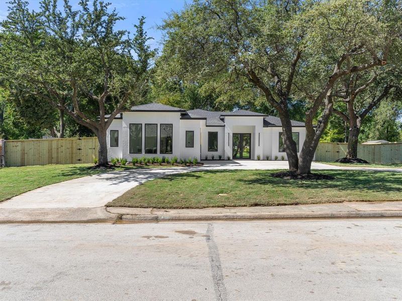 Modern home featuring a front lawn