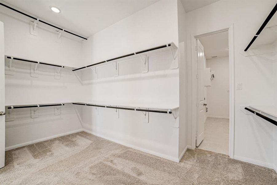 Primary closet leads directly into the utility room for your convenience.