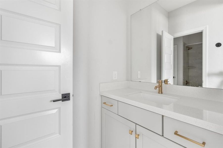 Upstairs bathroom features a tub/shower combo and long vanitywith plenty of counter space.