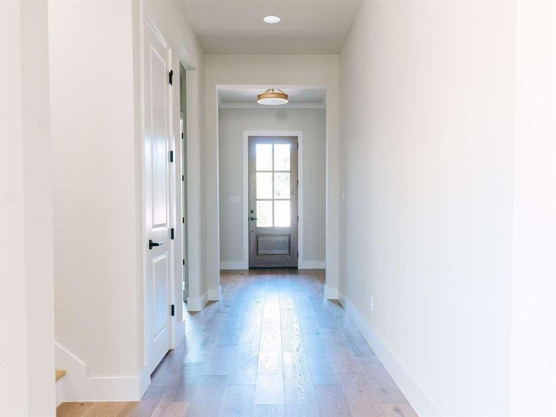 Entryway with light hardwood / wood-style floors