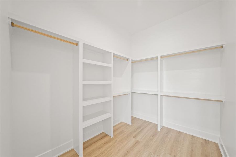 Spacious walk-in closet for the primary suite