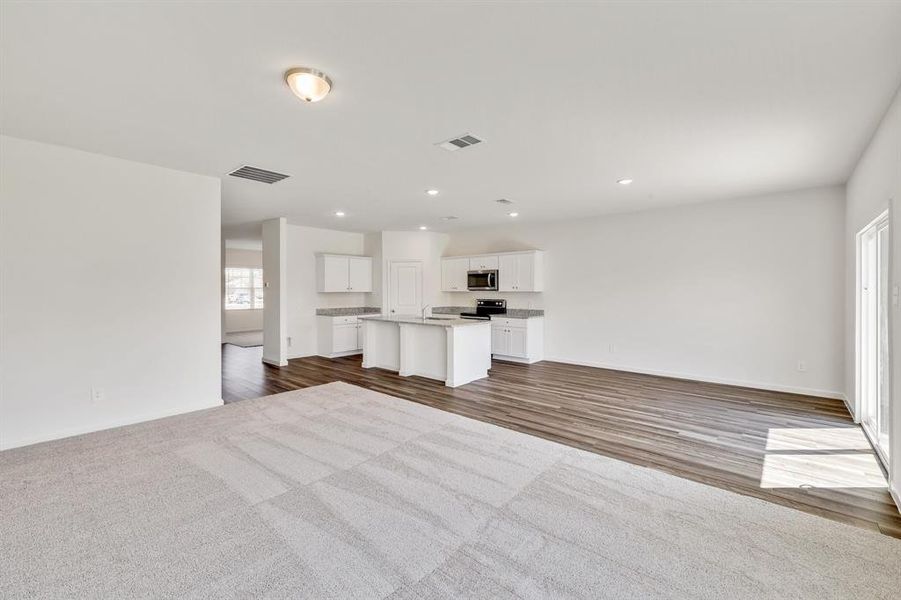 Unfurnished living room featuring light hardwood / wood-style flooring