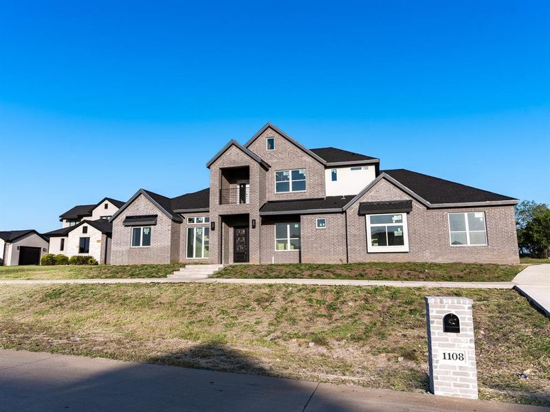 Craftsman-style house with a front lawn