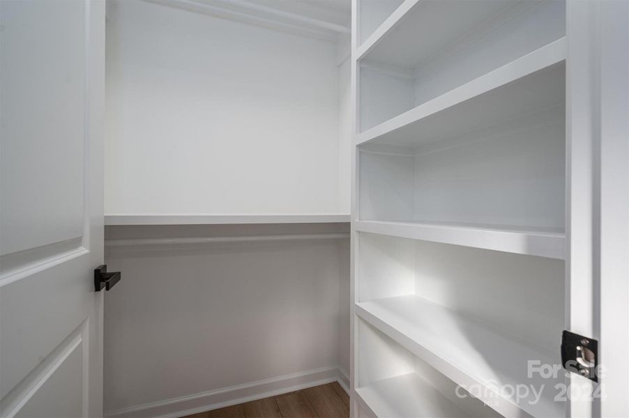 Custom built wood closet shelving.