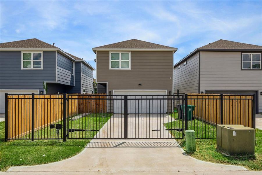 Optional rear automatic driveway gate and fencing.