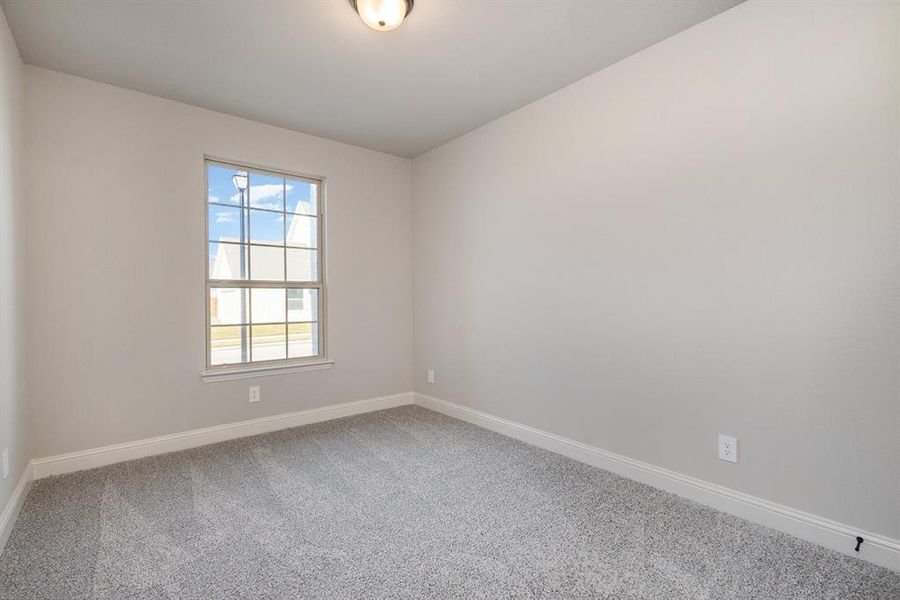 Empty room featuring carpet floors