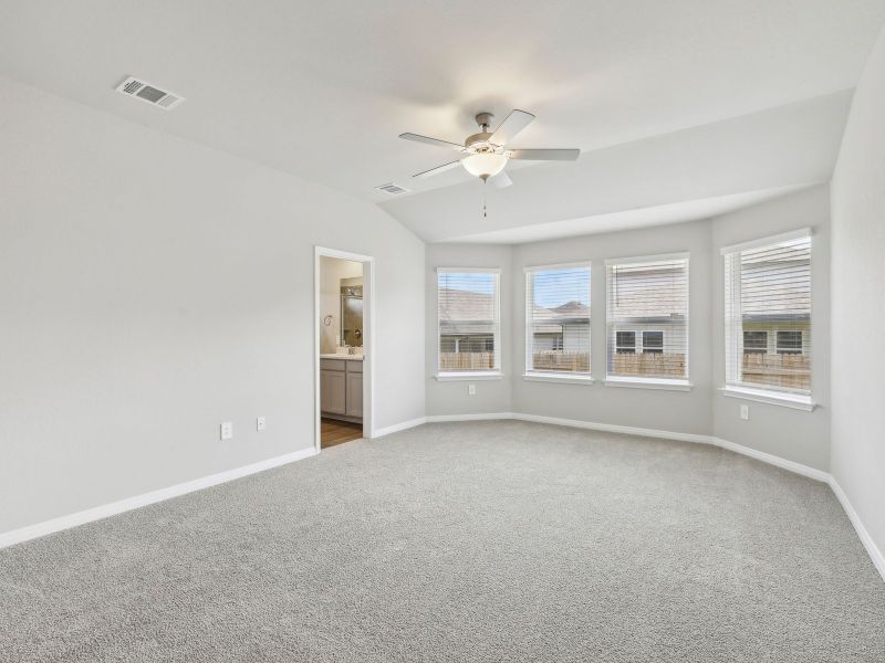 Enjoy some natural lighting with the bay window in the primary bedroom.