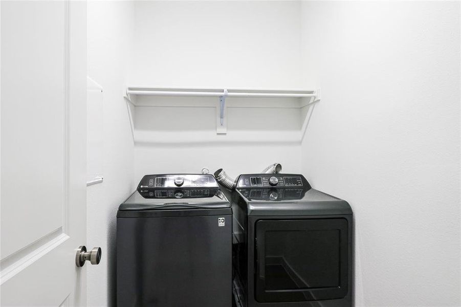 Laundry area with washer and dryer included