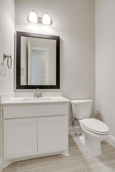 Bathroom featuring toilet and vanity