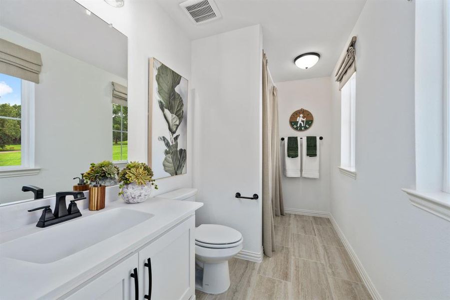 Bathroom with vanity and toilet