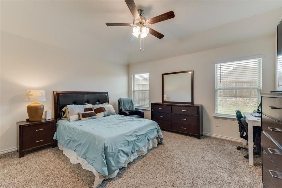 Bedroom featuring  carpet and ceiling fan