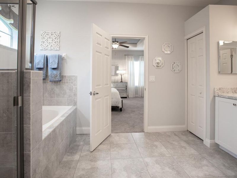 Luxuriate in your spa-like en-suite owner`s bath - Willow II with Loft home plan by Highland Homes