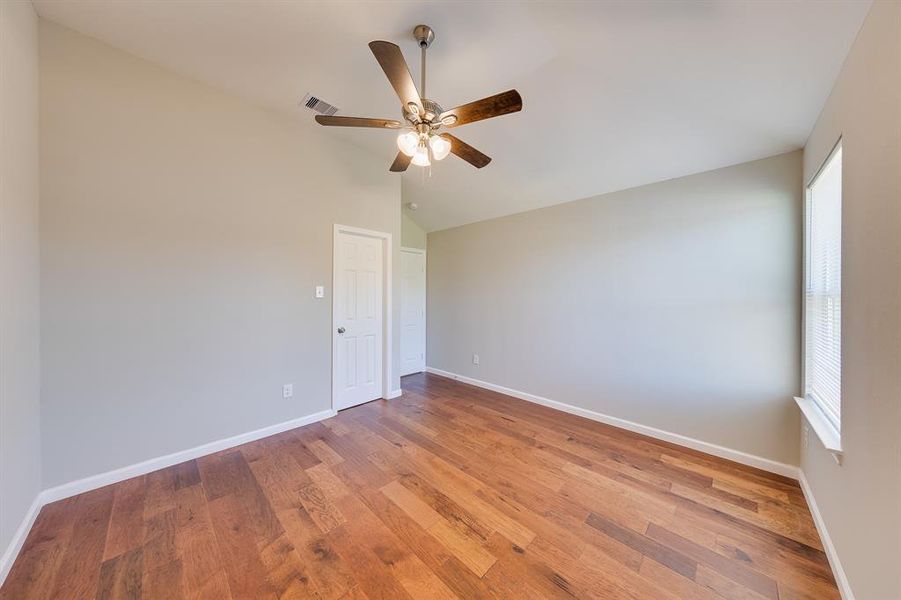 The inviting wood-like flooring in Bedroom #3 adds warmth and character to the space. This stylish flooring is not only aesthetically pleasing but also easy to maintain, creating a welcoming environment that complements any decor style. It’s a charming backdrop for your personal touches, making this room feel like home.