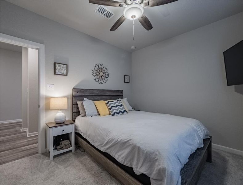 bedroom 2 with plush carpet and ceiling fan