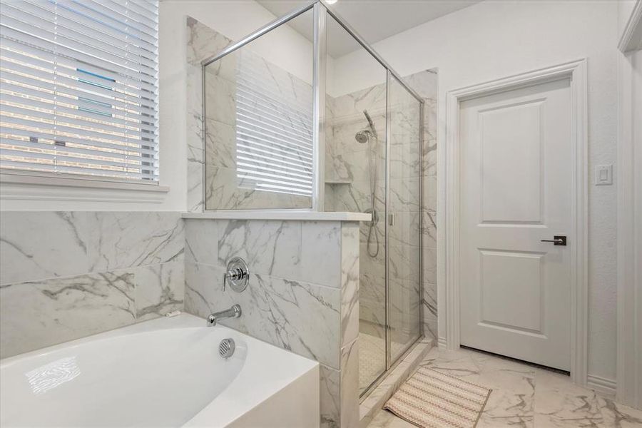 Bathroom featuring separate shower and tub