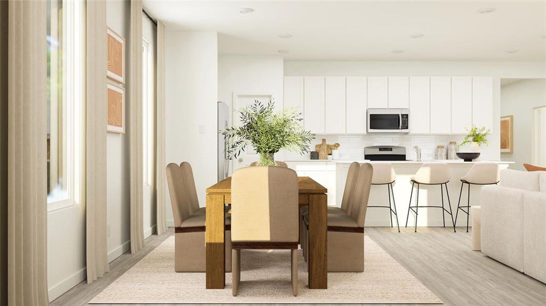 Dining area featuring light hardwood / wood-style floors