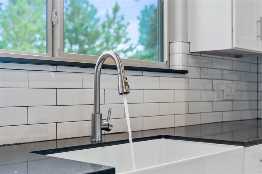 Farmhouse sink with stainless steel faucet