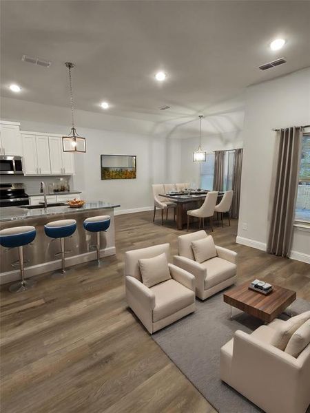 Living room featuring sink and dark hardwood / wood-style flooring