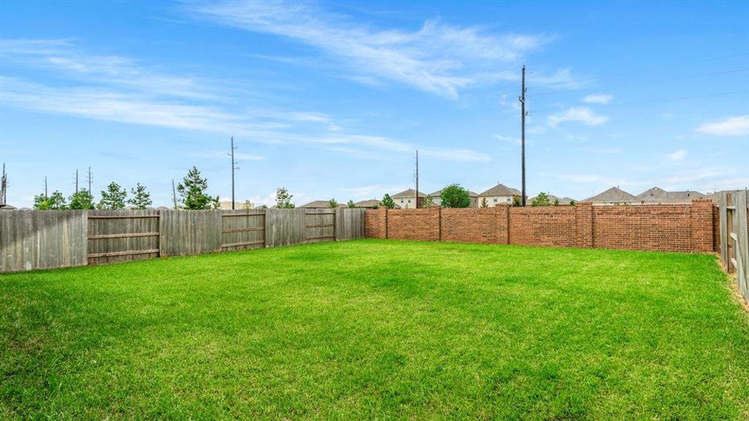 Premium lot with large yard, no back neighbors and brick back fence.