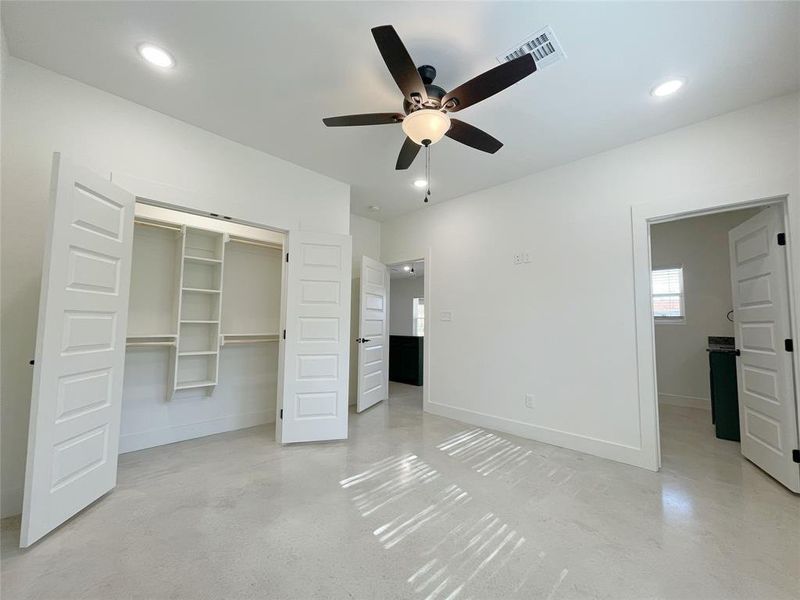 Unfurnished bedroom featuring ceiling fan and a closet