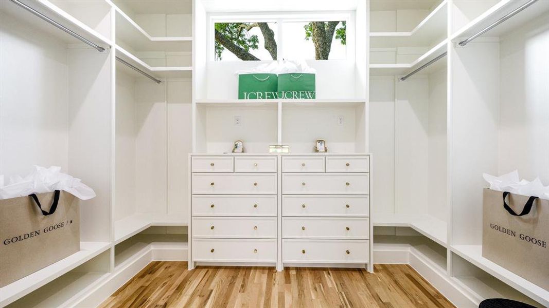 Spacious closet featuring light wood-type flooring