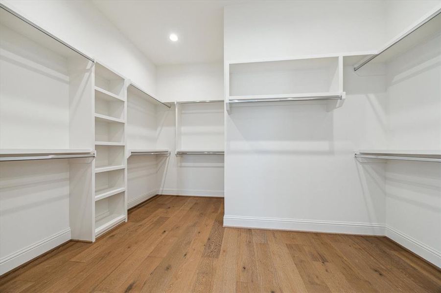 AMAZING CUSTOM Primary Closet with so many built-ins.