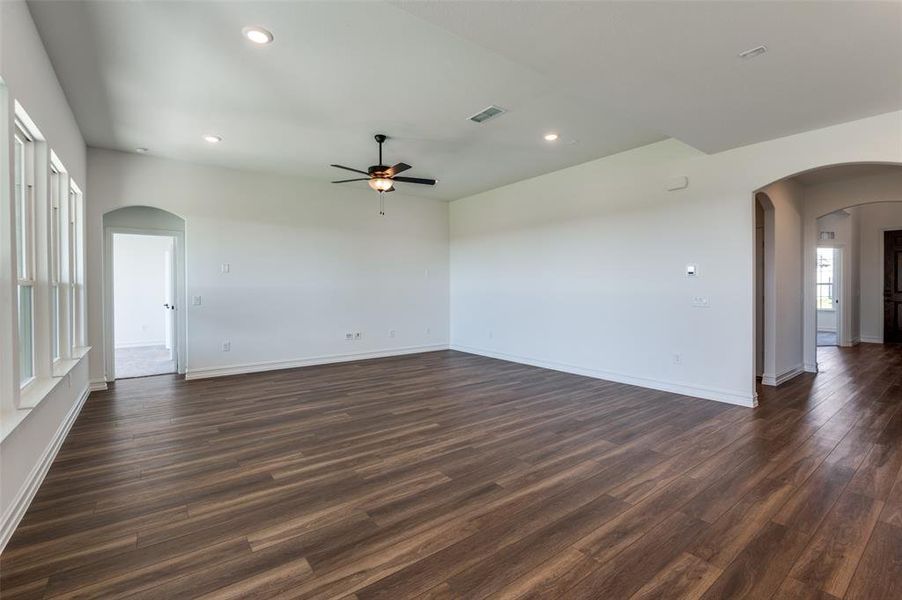 Spare room with ceiling fan and dark hardwood / wood-style flooring