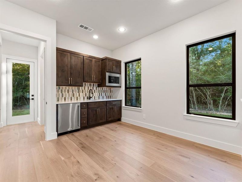 Sitting Area with Kitchenette Featuring Sink, Microwave, and Mini Refrigerator